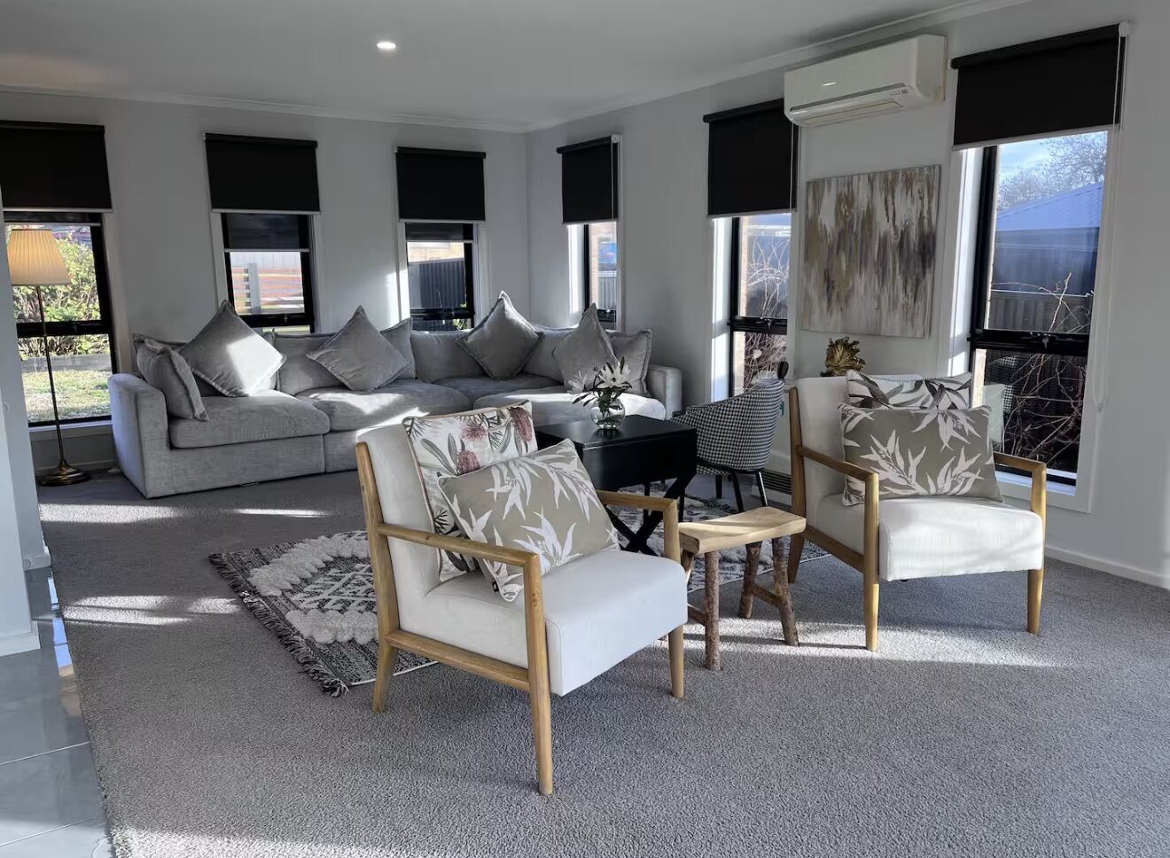 Light-filled living room with large windows at the Ararat retreat